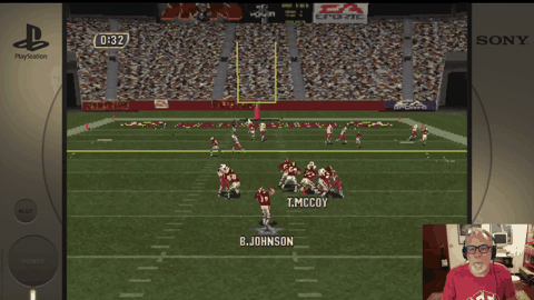 **On Screen Text:**- 0:32 - T.MCCOY **Jersey Text:** - B.JOHNSON - M.JONES - T.MCCOY **Background Logos:** - EA Sports - PlayStation - SONY